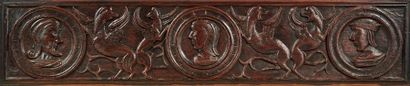 null Large longitudinal panel in oak carved in bas-relief with three profiles decorated...