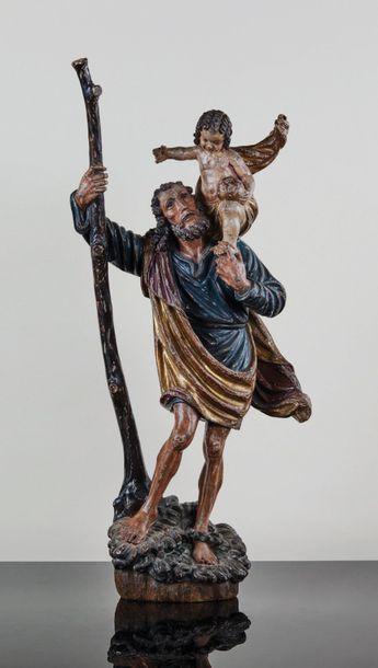 null Saint Christophe en bois sculpté en ronde-bosse, polychromé et doré. Le saint...