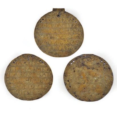  THREE MULETIERE PLATES in engraved brass: - decorated with angel heads surrounding...