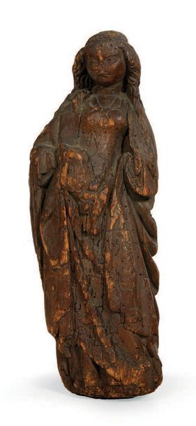  VIERGE À L'ENFANT in carved walnut. Standing, holding the Child on her right side,...