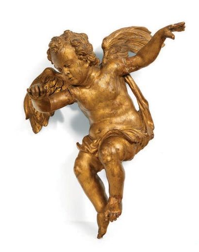  ANGEL in carved and gilded wood, sitting, wings spread, her naked body surrounded...