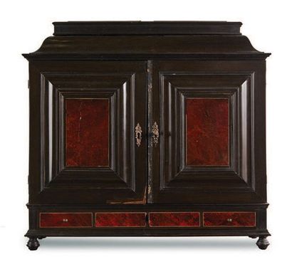 null Ebony and tortoise shell veneer cabinet with two doors opening to eight drawers...