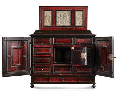 null Ebony and tortoise shell veneer cabinet with two doors opening to eight drawers...