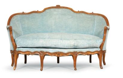 null BINNEY sofa in moulded and carved wood. Curved, ribbed feet, with floral falls....