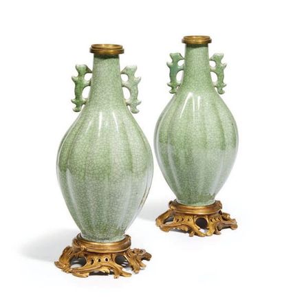 null TWO ribbed baluster vases in cracked celadon enamelled porcelain, two handles...