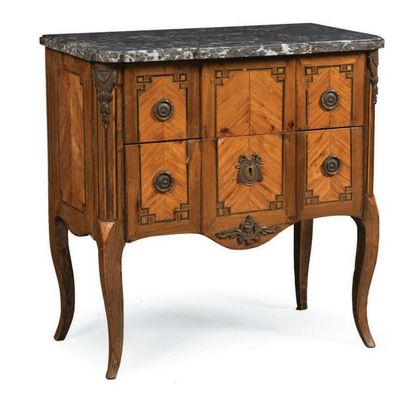 null A small jumping COMMODE made of rosewood veneer and framed with amaranth and...