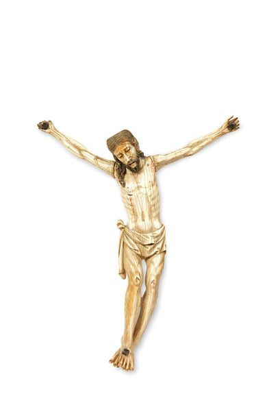 null GRAND CHRIST IN IVORY SCULPTED with polychrome highlights. Head inclined towards...