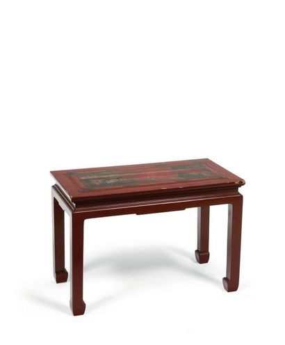 null A small red and green lacquered wooden table decorated with characters on the...