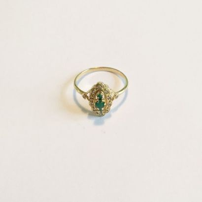 null Marquise ring in 18K (750) yellow gold set with three emeralds in a diamond...