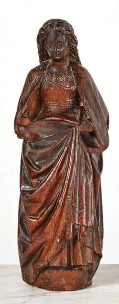 null SAINTE FEMME en chêne sculpté, élément de stalle ?.
La jeune sainte présente...