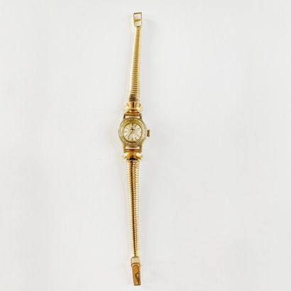 null Omega. Ladies' watch in 18K (750) yellow gold, the round dial adorned with a...