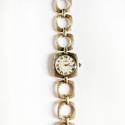 null TISSOT. 

Ladies' watch in textured silver made of openwork quadrangular links....