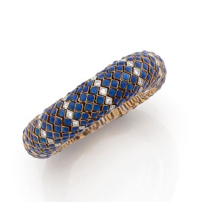 DAVID WEBB. 
FLEXIBLE BRACELET in platinum and 18K (750) yellow gold applied with...