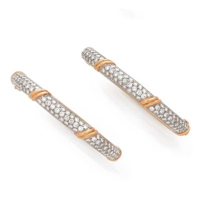 Van CLEEF & ARPELS. 
Pair of opening bracelets in platinum and 18K (750) yellow gold,...
