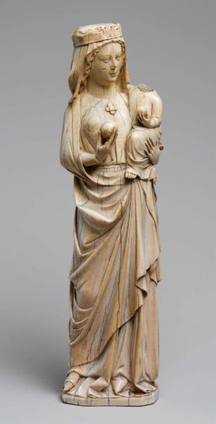 null Virgin and Child in carved ivory with rare polychrome remains. Standing with...