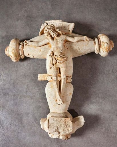 null Christ on the cross with a carved limestone crown. Ovoid branches with flattened...