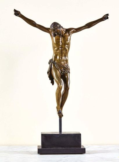 null Cristo morto in chased and gilded bronze. Head tilted on his right shoulder,...
