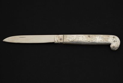 null An elegant silver Hallah knife and cork-screwer
Warsaw, 1893
This knife was...