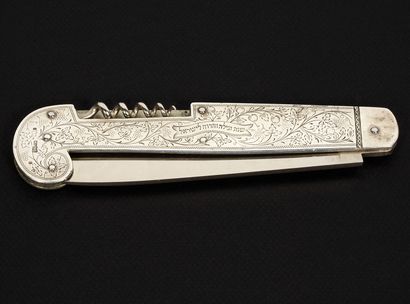 null An elegant silver Hallah knife and cork-screwer
Warsaw, 1893
This knife was...