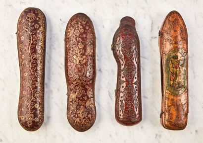 null Set of four cases:
- travel case with wooden core covered with red leather gilded...