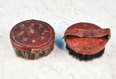 null Set of two garment brushes with wooden core covered with leather gilded with...