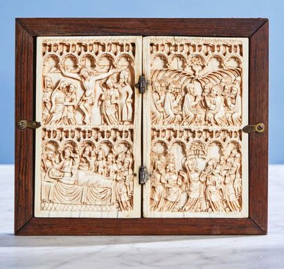 Ivory diptych carved in two registers. Left...