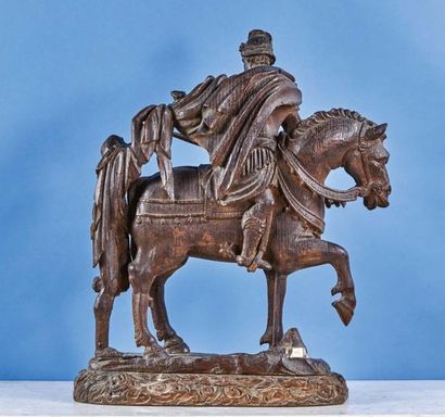 null Saint Martin in oak carved in the round. The saint on horseback, dressed as...