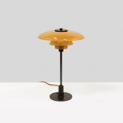 Poul Henningsen (1894-1967) Lamp model "PH 3/2"
Patinated brass and colored glass
Patinated...