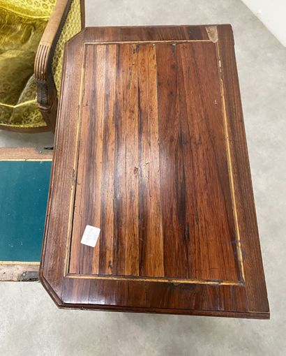 null Secretary In rosewood veneer with butterfly wing marquetry, the uprights with...