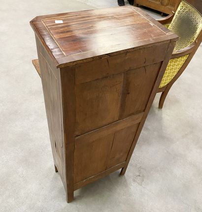 null Secretary In rosewood veneer with butterfly wing marquetry, the uprights with...