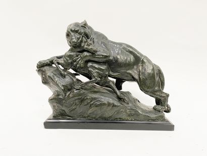 null Bronze sculpture representing a lioness hunting an antelope Bronze print with...
