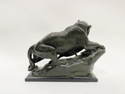 null Bronze sculpture representing a lioness hunting an antelope Bronze print with...