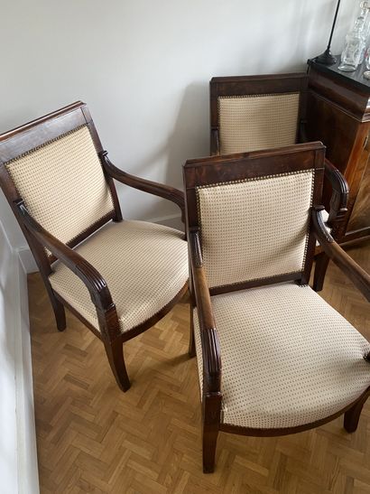 null Suite of three mahogany armchairs, decorated with palmettes, the armrest supports...