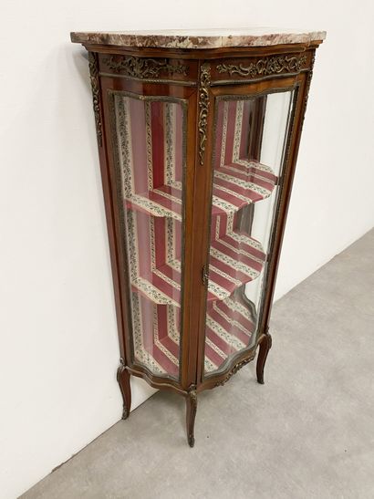 null Rosewood veneered cabinet, ormolu and chased ormolu ornamentation, with curved...