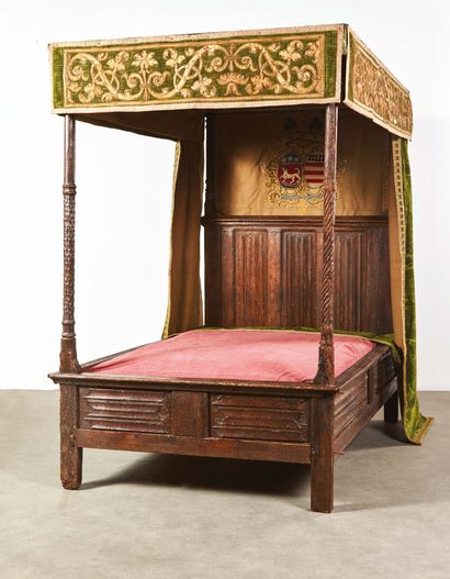 null Carved oak canopy bed. Foot of the bed with columns, one twisted, the other...