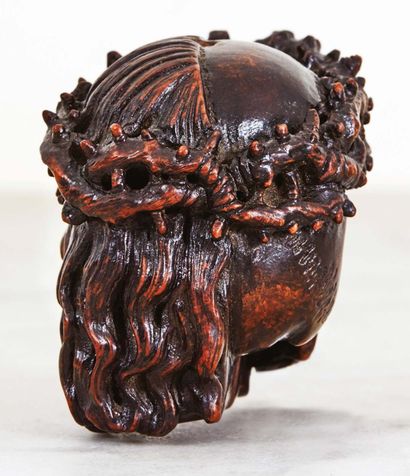 null Memento mori biface in carved fruitwood representing on one side the head of...