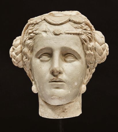 Caryatid woman's head in stucco with white...