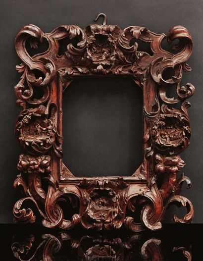 null Poplar frame carved in high relief. Decorated with leafy scrolls and horns of...