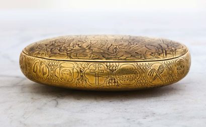 null Oval engraved brass box representing, on the face, the Crucifixion and the Entombment...