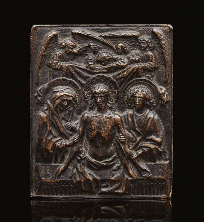 null Black patina bronze plaque depicting Christ emerging from the tomb between the...