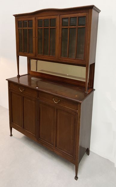 null Double chest of drawers in walnut and light wood fillets, the upper part opening...