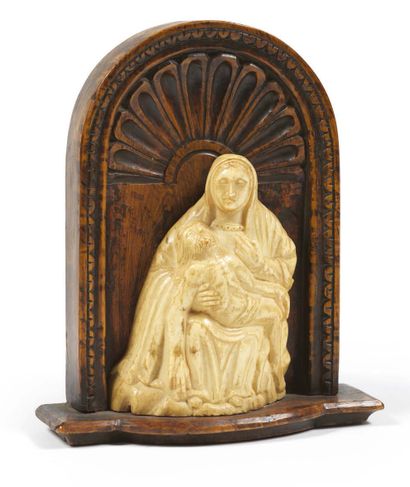  Carved ivory VIRGIN OF PITY mounted as a kiss of peace on a terrace in front of...