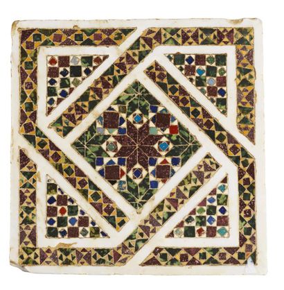  A white marble paving tile with geometrical decoration inlaid with green and red...