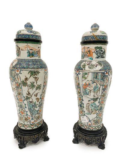 null China Pair of polychrome porcelain covered vases decorated with characters in...