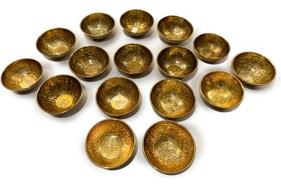 Set of 16 copper dishes with embossed decoration...