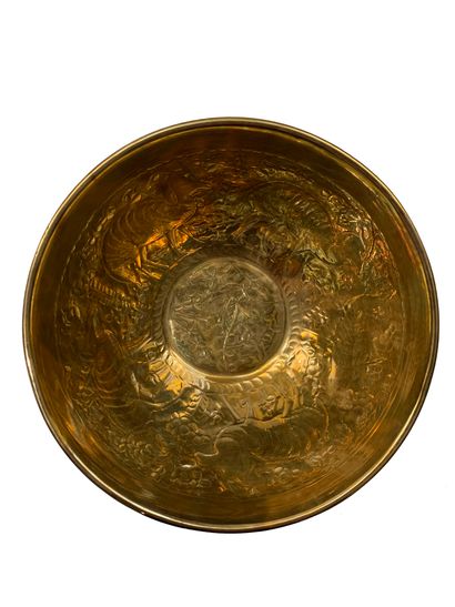  Set of 16 copper dishes with embossed decoration of animals and plants. Work of...