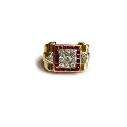  An 18K (750) yellow gold scroll ring, the square bezel set with round diamonds and...