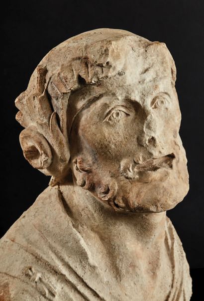 null Bust of a helmeted man in sculpted limestone. The man looks up to his right,...