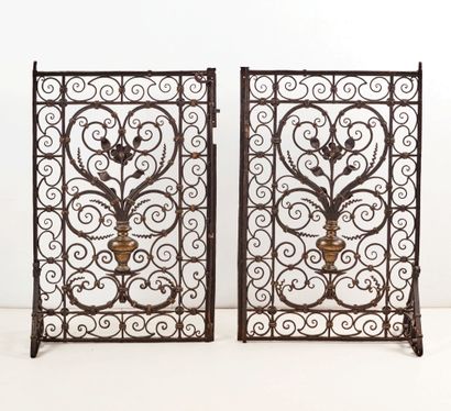 null Pair of elements of a choir or chapel grille in wrought iron and bronze. Decorated...