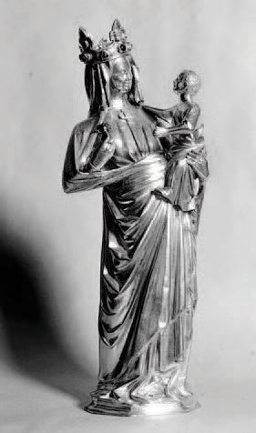 null Vierge à l'Enfant en ivoire sculpté avec traces de polychromie, dos plat. Le...
